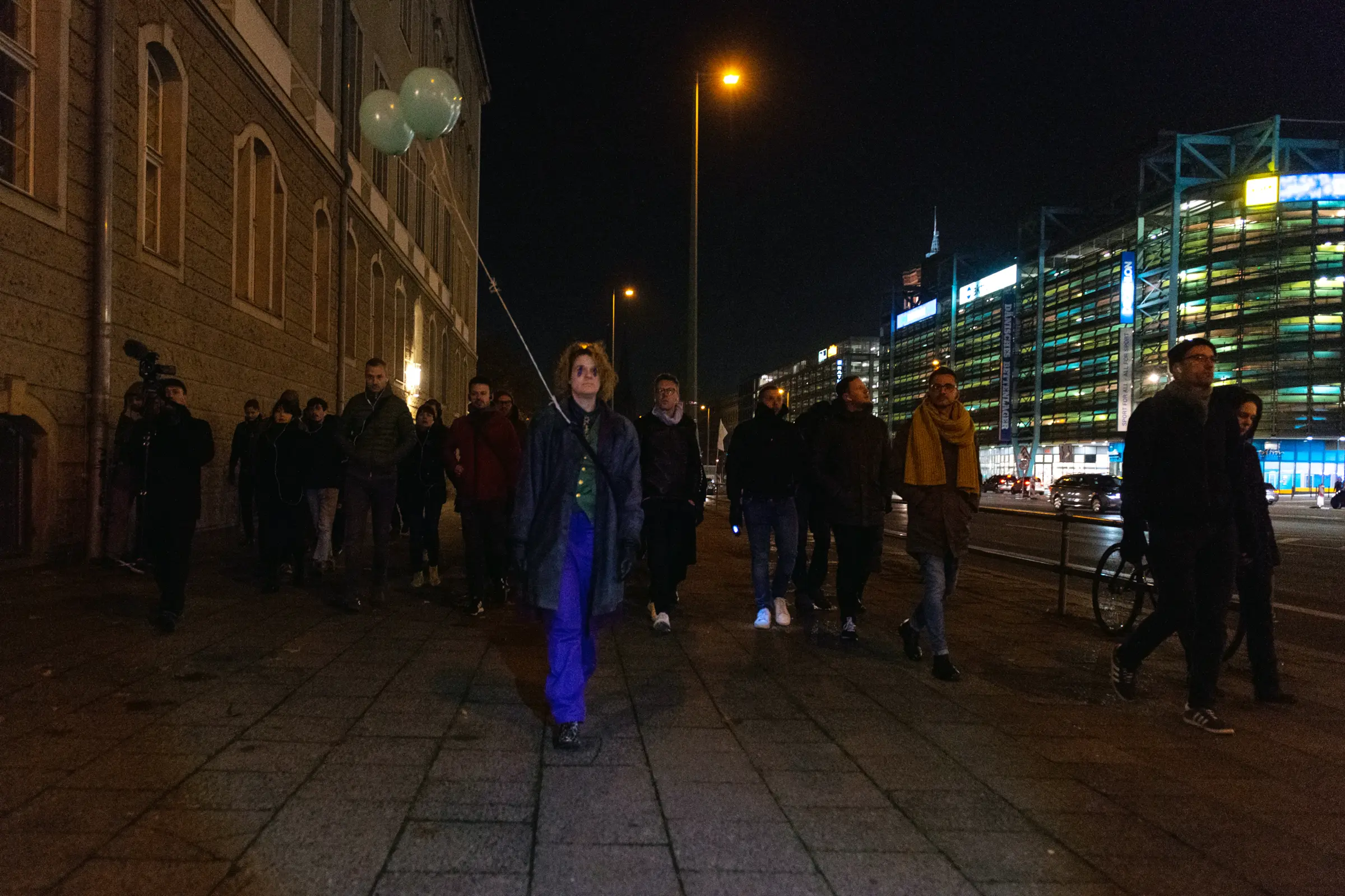 Participants on the way to the World Time Clock; Birte Flint performing as the hippo.