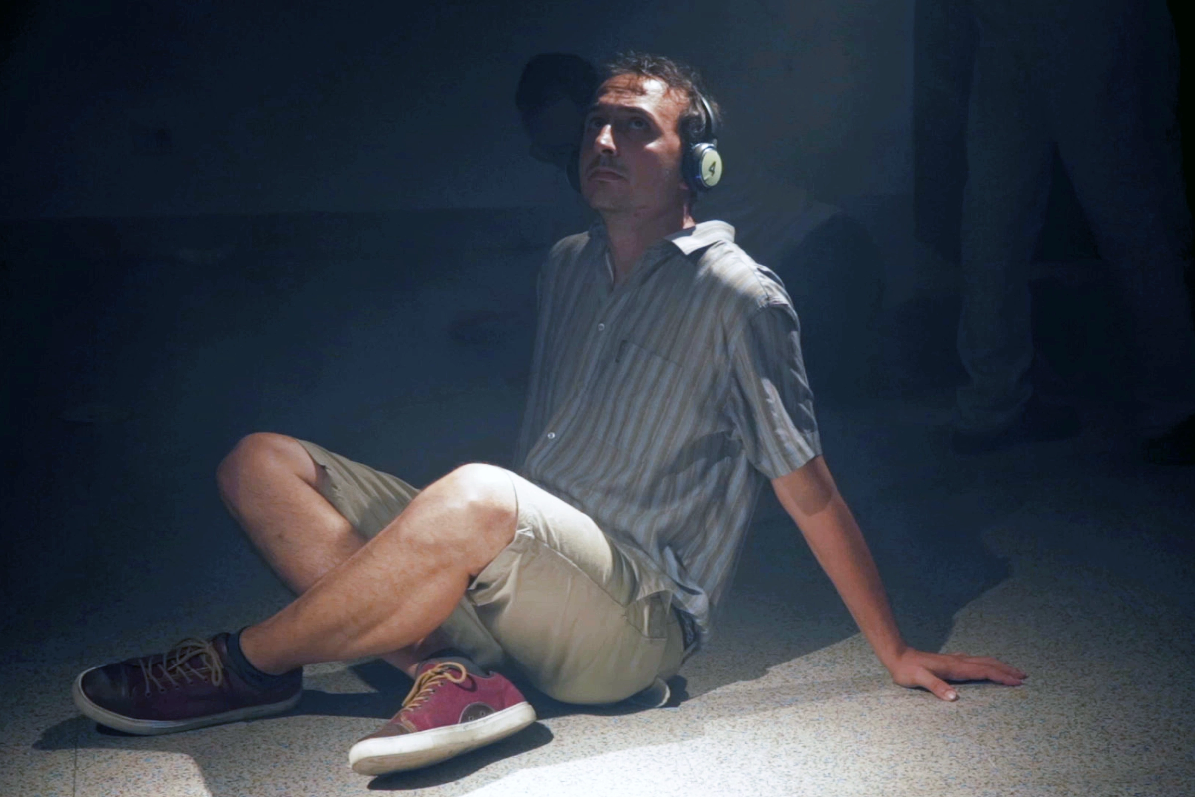 Participant listening with wireless headphones in the room.