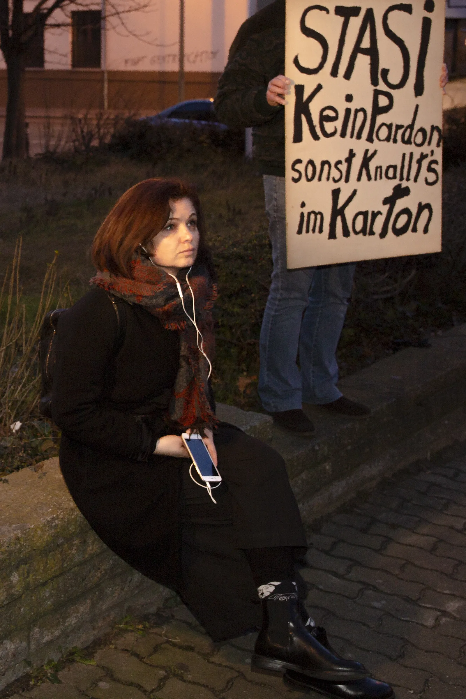 Participant listening at one station using headphones.
